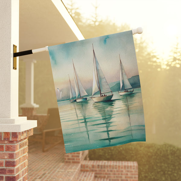 Towel with sailboat design hanging on a line outdoors