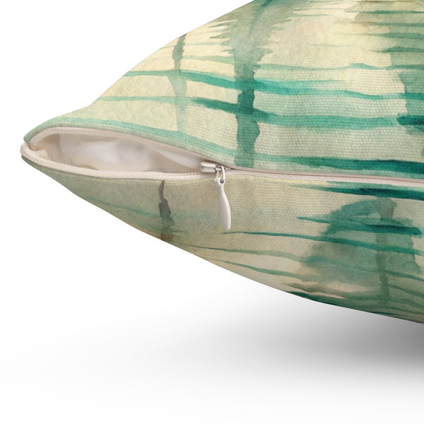 Decorative pillow with green abstract pattern on a white background