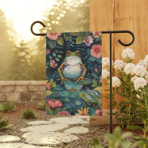 Garden flag with a frog design hanging outdoors.