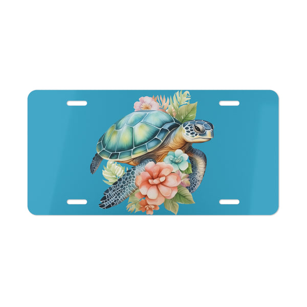 License plate with a turtle and floral design on a blue background