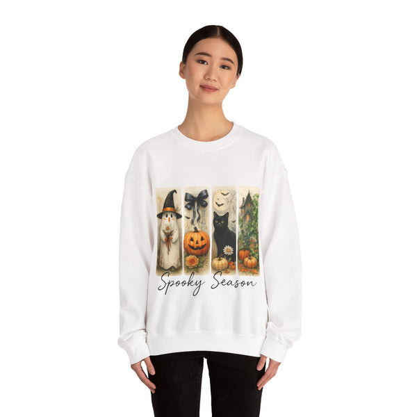 Person wearing a white sweatshirt with Halloween-themed design on a white background