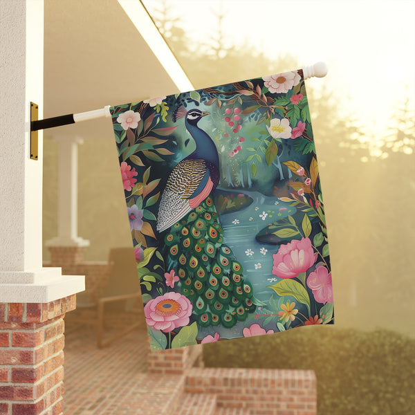 Decorative towel with peacock design hanging on a railing outdoors.