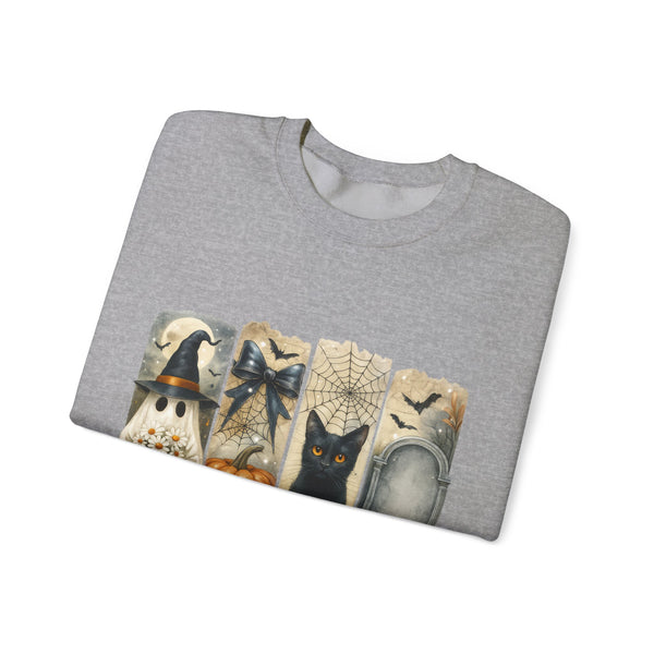 Folded gray t-shirt with Halloween-themed design on a white background