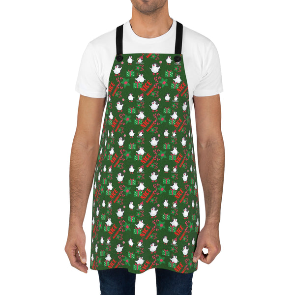 Person wearing a green apron with festive pattern on a white background