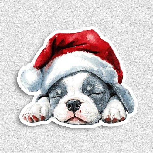 Illustration of a sleeping puppy wearing a Santa hat on a light gray background