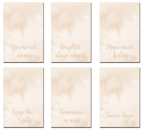 Set of six motivational cards with gold text on a beige background