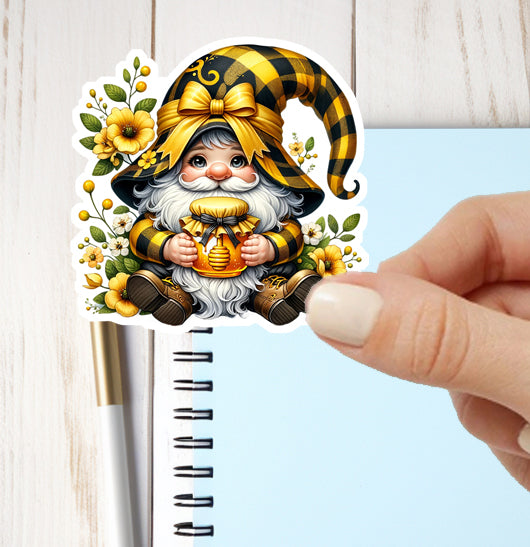 Decorative sticker of a gnome with a checkered hat on a notebook