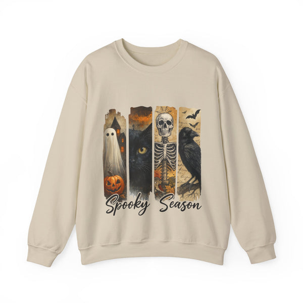 Beige sweatshirt with Halloween-themed design featuring ghost, cat, skeleton, and owl on a white background.
