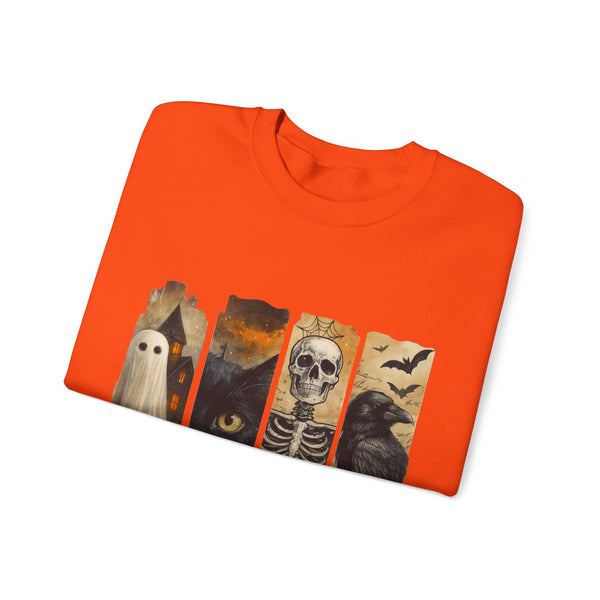 Folded orange t-shirt with Halloween-themed design on a white background