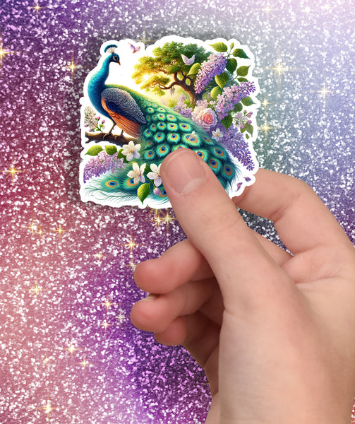 Hand holding a peacock sticker against a glittery purple background
