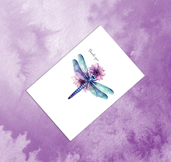Greeting card with a dragonfly and flower design on a purple watercolor background