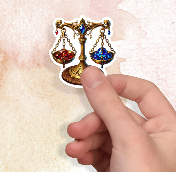 Hand holding a sticker of a decorative scale with gemstones on a textured beige background