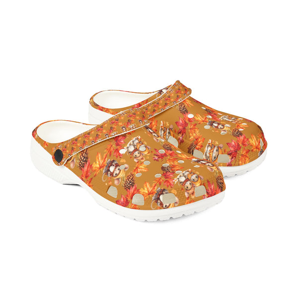 Pair of clogs with autumn-themed design on a white background