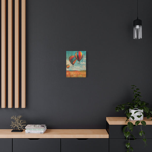 Modern interior with a dark wall, wooden shelf, and colorful painting of hot air balloons.