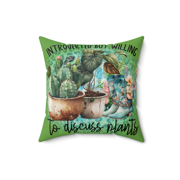 Decorative pillow with plant-themed design and text on a white background