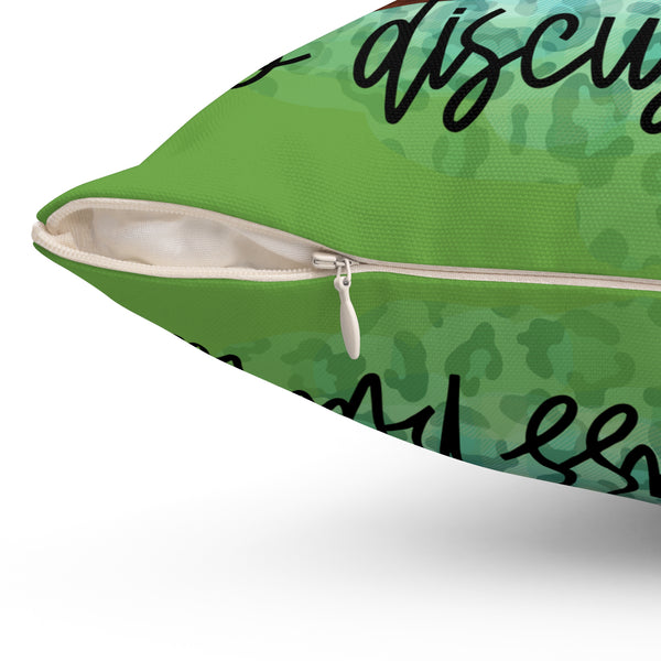 Green pillow with text on a white background