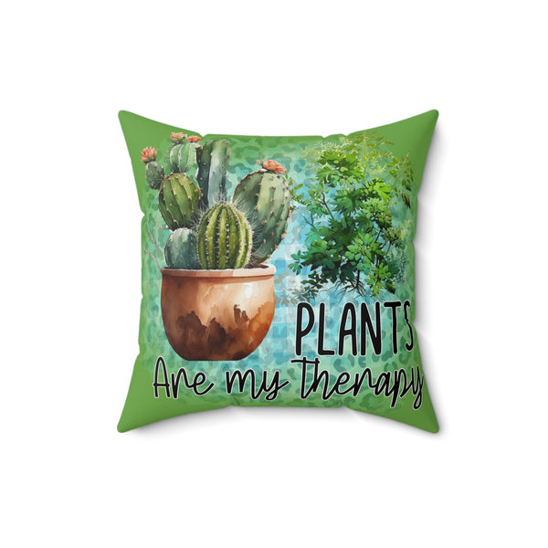 Pillow with cactus design and 'Plants are my therapy' text on a white background