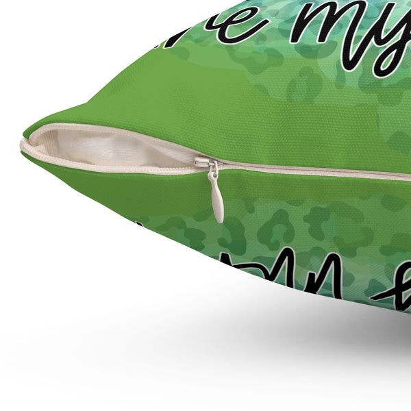Green pillow with text on a white background