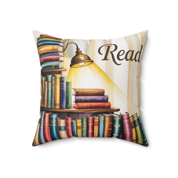 Decorative pillow with bookshelf design and 'Read' text on a white background
