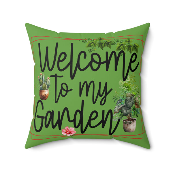 Green pillow with 'Welcome to my Garden' text and plant illustrations on a white background