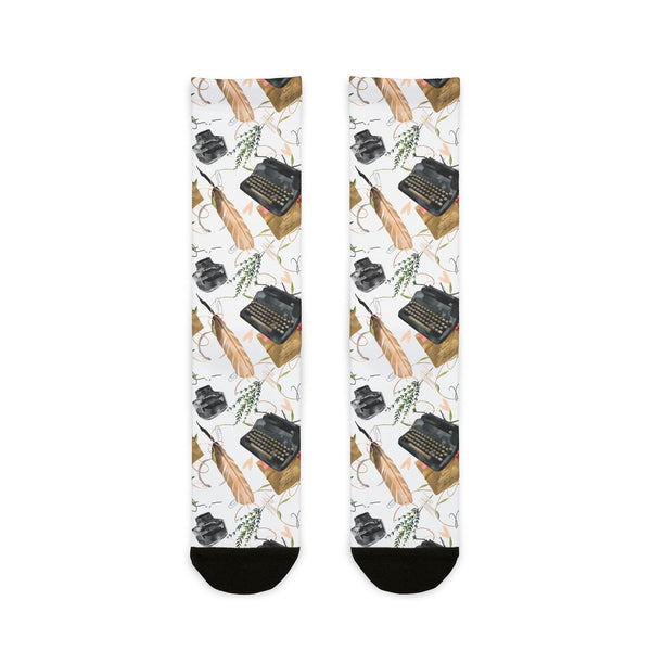Socks with typewriter and feather pattern on a white background